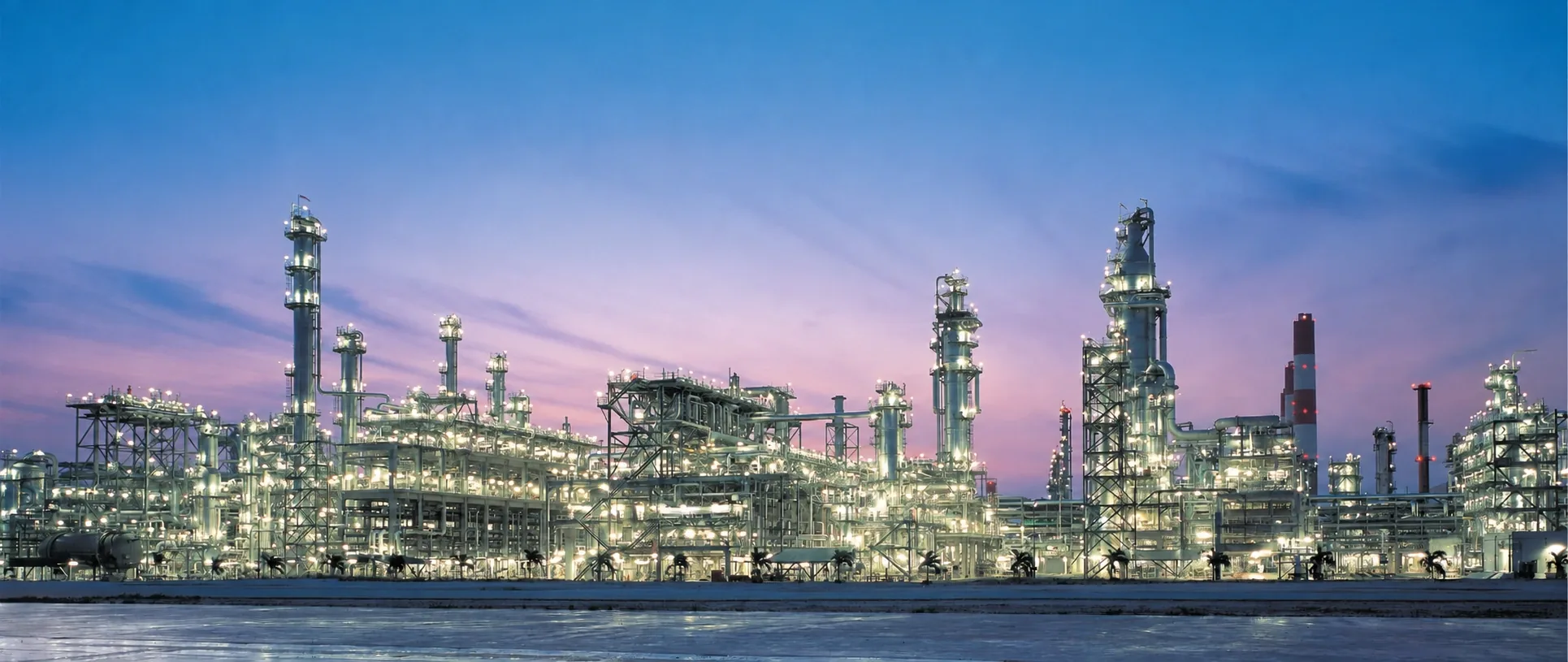 Illuminated refinery at dusk